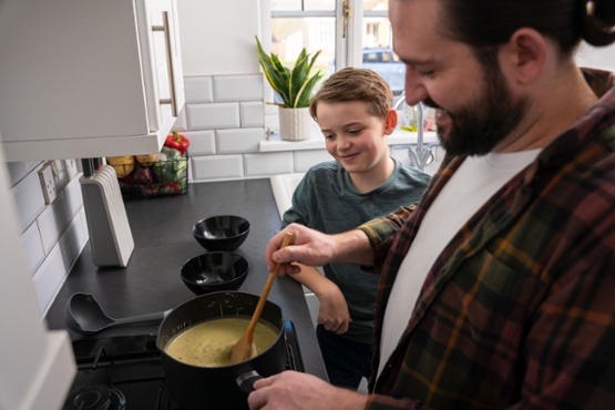 Man and boy cooking
