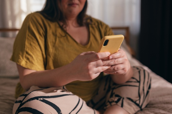 A woman looking at her phone
